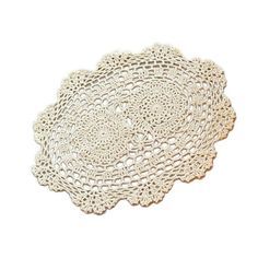 a white doily on a white background