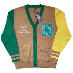 Make a bold statement and wear your Norfolk State pride with this one-of-a-kind and comfortable cardigan sweater, perfect for any alumni, students or supporters. Made with the highest quality materials, this sweater is designed to keep you warm and cozy while representing NSU. Features:- Official Norfolk State University logo embroidered on the chest- Large "N" Chenille patch- Classic cardigan design with a tortoise shell button-up front- Two front pockets (deep enough to fit a phone and other e Varsity Cardigan For Winter College Season, Winter Varsity Cardigan, Varsity Style Cardigan For College In Winter, Varsity Style Winter Cardigan For College, Sporty Fall Cardigan For College, Collegiate Long Sleeve Cotton Cardigan, Collegiate Cotton Long Sleeve Cardigan, Collegiate Cardigan For College In Fall, Collegiate Fall Cardigan For College