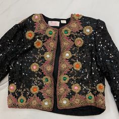 Vintage Margo Moore black sequins top Size: M 1980s chest-19” shoulder-6” Sleeve-21” top to bottom-19” Black Spring Top With Contrast Sequin, Spring Black Tops With Contrast Sequin, Spring Black Top With Contrast Sequin, Black Tops With Contrast Sequin For Spring, Black Sequin Top For Spring, Black Contrast Sequin Top For Evening, Black Sequined Tops For Evening, Evening Black Top With Contrast Sequin, Beaded Tops For Fall Night Out