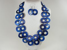 Statement mother of pearl  blue and white necklace,  blue and white shell Pearl Necklace Necklace, blue necklace, white  statement shell   Necklace is made from blue mother of pearl donut beads and white glass beads 10mm,  measures approx. 19" plus an additional 4" inches with silver extender. 2 Strands, light weight. Closure is a  lobster clasp with silver extender chain with bead dangle. My beautiful jewelry makes warm and personal gift for you, your family and friends, and all come in jewelry Handmade Blue Pearl Necklace, Elegant Blue Shell Necklace For Gift, Elegant Handmade Blue Shell Necklace, Elegant Blue Shell Necklace As A Gift, Handmade Blue Mother Of Pearl Jewelry, Blue Shell Beaded Necklaces, Blue Shell Jewelry For Gifts, Handmade Blue Shell-shaped Necklace, Handmade Blue Shell Jewelry