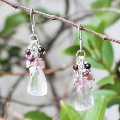 These hand-crafted semi-precious stone dangle earrings feature natural pink Rose Quartz semi precious teardrop gemstones, crowned with sparkling Ruby and Tourmaline gemstone drops. They have been meticulously hand wrapped with solid 925 Sterling Silver.  Each unique piece is hand-craft in my South Yarra Melbourne studio, so you know that the piece you select is as individual as you, created with thought and care. Stone: Rose Quartz, Ruby & Tourmaline Colour: Pink Main Stone Size: 2cm x 1.3cm Metal: 925 Solid Sterling Silver Earrings Drop Length: 5cm Earrings Width: 1.3cm Each piece arrived beautifully packaged in a sturdy box, ready for gift giving or safe keeping. Gift wrapping can be selected as an add-on. I love making beautiful, handmade one-of-a-kind pieces of jewellery using semi-pre Rose Quartz Gemstone Dangle Earrings, Pink Sterling Silver Briolette Earrings, Pink Rose Quartz Earrings With Natural Stones, Pink Briolette Sterling Silver Earrings, Pink Briolette Earrings With Natural Stones, Pink Briolette Natural Stone Earrings, Pink Gemstone Accented Earrings For Gift, Pink Gemstone Accents Earrings For Gifts, Pink Gemstone Earrings For Gift