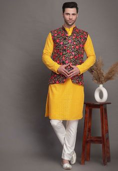 Faux Georgette Kurta in Yellow.This Readymade attire is Enhanced with Resham and Zari Work. Crafted in Chinese Collar Neck and Full SleeveAvailable with a Cotton Pajama in White and an Art Matka Silk Nehru Jacket in BlackDo note: Footwear shown in the image is for presentation purposes only. Half to one inch may vary in measurement. (Slight variation in actual color vs. image is possible)  We sell all kinds of menswear. Mens Kurta | Mens Kurta Pajama | Mens Sherwani | Mens Sherwani Sets | Tradit Traditional Fitted Outerwear With Embroidered Sleeves, Winter Floral Embroidered Long Sleeve Sets, Winter Floral Embroidery Long Sleeve Sets, Embroidered Stand Collar Kurta For Winter, Fitted Winter Outerwear With Chikankari Embroidery, Fitted Floral Embroidery Sets For Winter, Festive Fitted Multicolor Embroidered Outerwear, Festive Fitted Outerwear With Multicolor Embroidery, Fitted Festive Outerwear With Embroidered Sleeves