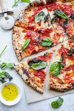 a pizza sitting on top of a white cutting board