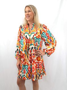 colorful babydoll shirt dress on model from front Multicolor Lantern Sleeve Dress For Spring, Multicolor Lantern Sleeve Spring Dress, Colorful Long Sleeve Dress For Fall, Multicolor Smock Dress For Fall, Colorful Long Sleeve Bohemian Dress, Vibrant Printed Long Sleeve Dress, Vibrant Long Sleeve Printed Dress, Vibrant Long Sleeve Spring Dresses, Multicolor Dresses With Vibrant Print For Fall