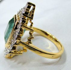 Emerald Ring, vintage 18K solid gold hallmarked Natural Emerald Diamond gemstone ring. Beautiful collection piece in very good condition. USA ring size -7.5 ( we can adjust size), size of top-30/17 mm, emerald weight-5.19 carat, diamond weight-1.18 carat VS G. Will supply with a certificate. Vintage Style Emerald Cluster Ring In Yellow Gold, Classic Gold Emerald Cluster Ring, Formal Gold Rings With Emerald, Formal Gold Emerald Ring With Center Stone, Gold Emerald Cluster Ring Hallmarked, Gold Art Deco Emerald Ring In 14k Gold, Gold Emerald Cluster Ring For Formal Occasions, Gold Emerald Cluster Ring For Formal Events, Art Deco Emerald Ring Collectible