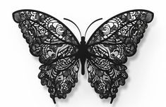 a black butterfly is hanging on the wall