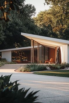 a modern house in the middle of some trees