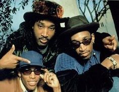 three men in hats and sunglasses posing for the camera