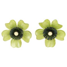 These lovely Monique Vedie resin or Talosel clip-on earrings feature a daisy flower shape with a carved dimensional design complimented with a textured pattern in glittering pistachio green and black colors with a tiny mirror heart. The pieces have French clip fastenings. There is no visible signature like all the Monique Vedie vintage pieces. Measurements: 1.69 in diameter (4.2 cm) Note: Monique Vedie was born in the 1920s and has been a student at the Line Vautrin School in Paris, where she le Tiny Mirror, A Daisy Flower, Line Vautrin, French Clip, Pistachio Green, Cellulose Acetate, Antique Earrings, Clip Earrings, French Design