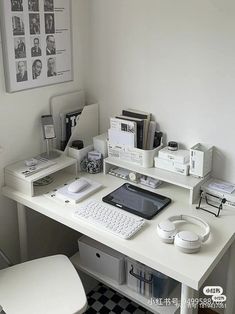 a white desk topped with a computer monitor and keyboard