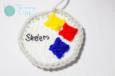 a crocheted ornament with the name sherbers written on it