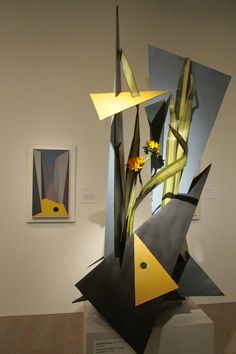 an abstract art piece is displayed in a museum