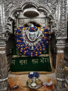 the shrine is decorated with flowers and other things to decorate it for diwaling