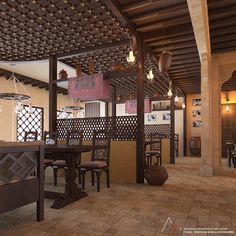 the inside of a restaurant with tables, chairs and lanterns hanging from the ceiling above