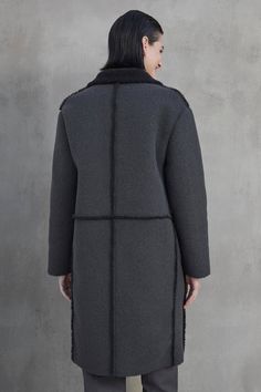 This coat features a button front, lapel, and side seam patch pockets, with a cozy faux sherpa interior and trims for added warmth. Shearling Outerwear With Pockets For Work, Long Fur Coat With Pockets For Work, Shearling Long Coat For Work, Velvet Tees, Sherpa Coat, Cami Shirt, Long Sleeve Coat, Black Chelsea Boots, Long Sleeves Coats