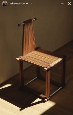 a wooden chair sitting on top of a hard wood floor