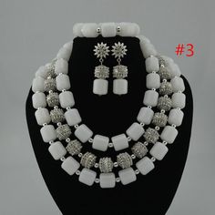 Custom-made Jewelry Set for African Wedding Party in Nigerian | Etsy White Crystal Bridal Sets For Party, White Crystal Bridal Accessories For Formal Occasions, Formal White Crystal Bridal Accessories, Formal White Bridal Accessories With Crystals, Elegant White Bridal Sets For Party, White Pearl Jewelry With Silver Beads, Elegant White Pearl Bridal Sets, Silver Beaded Necklaces For Wedding, White Pearl Necklace With Silver Beads For Party