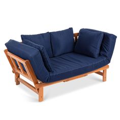 a blue couch sitting on top of a wooden frame