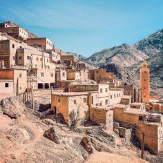 an old village in the middle of mountains with no people or buildings on it,