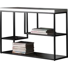 a black shelf with books and magazines on it