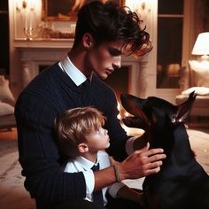 a man and his son are petting a dog in front of a fire place