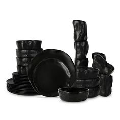 black dinnerware is stacked on top of each other