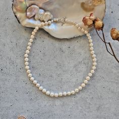 "Cultured Freshwater Pearl Strand Necklace.  Princess of 18\" or Matinee Length of 24\" long. Pearl Size: 8-9MM. Pearl Quality: Lightly wrinkled and blemished.  Great luster. Pearl Shape: semi-round. Finding: Sterling silver toggle loop clasp. https://www.etsy.com/shop/MYGEMSROCK" Round Pearl Necklace With Lobster Clasp, Classic Adjustable 16 Inch Necklace, Classic Single Strand Necklace Gift, White Sterling Silver Clasp Necklace For Everyday, White Necklace With Sterling Silver Clasp For Everyday, White Sterling Silver Necklace For Everyday, Everyday White Necklace With Sterling Silver Clasp, Classic Round Beaded Necklaces As Gift, Single Strand Pearl Necklace Gift