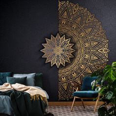 a bed room with a neatly made bed next to a green chair and potted plant