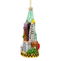 a glass ornament with a cityscape in the shape of a building