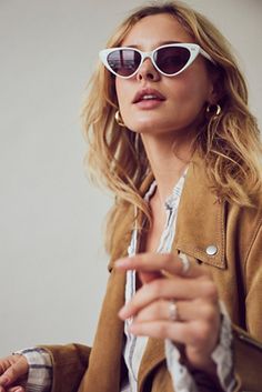 Olympic Cat Eye Sunglasses | Free People White Sunglasses Outfit, Sunglass Photography, White Cat Eye Sunglasses, 2024 Fits, Look 80s, Futuristic Sunglasses, Celebrity Sunglasses, Tan Legs, Face Accessories