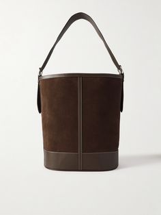 Hunting Season says this tote is the perfect balance of practicality and sophistication. It's been handcrafted in Spain from supple suede and detailed with tonal leather trims and signature topstitching. The canvas-lined interior has plenty of room for a continental wallet, water bottle and tablet, while the slip pocket will keep smaller essentials like your lip-gloss from getting lost at the bottom. Luxury Suede Bucket Bag For Everyday, Luxury Everyday Suede Bucket Bag, Elegant Suede Bucket Bag Tote, Classic Suede Shoulder Bag With Palladium Hardware, Elegant Suede Shoulder Bag With Leather Trim, Luxury Suede Bucket Bag, Elegant Suede Bucket Bag, Formal Leather Bucket Bag With Leather Trim, Luxury Workwear Bags With Suede Lining