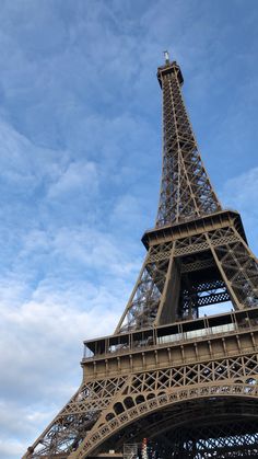 the eiffel tower is very tall and has a clock on it's side