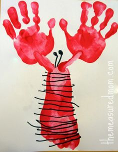 a child's handprint with red paint on it