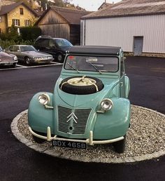 an old fashioned car is parked in the parking lot