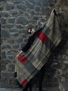 Brunt Red, Rust, Beige and Black are the colours in this unique handcrafted scarf. The body has elaborate motifs of the Ginkgo tree, which is known to bring luck and is also a symbol of love. The leaves are subtly drawn in red clay against the deep orange background. The motif is combined with a graphic edge in black. The border in black though subtle makes the scarf truly stand out and can be used as an exclusive evening wrap to pop up any attire. Crafted out of high-quality Tussar silk, this classic scarf is smart and sophisticated. The black border highlights the rusty red body. The warm colours make it a perfect accessory to complement a range of different colour outfits. The beautiful texture allows you to drape it in multiple styles and give the scarf your signature look.This scarf i Luxury Festive Raw Silk Scarf, Luxury Traditional Raw Silk Scarf, Pashmina Wrap, Flexible Working, Face Light, Pashmina Shawl, Block Printing, Inception, Handmade Artisan