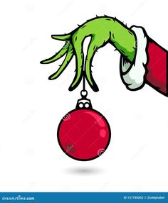 a hand holding a christmas ornament with green hands and red ball hanging from it