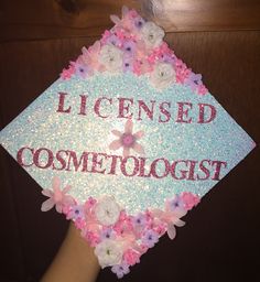 a decorated graduation cap with flowers on it