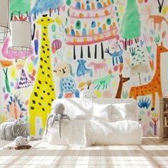 a room with colorful wallpaper that has giraffes and other animals on it