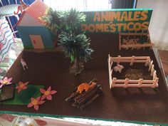 an animal farm is displayed on a table