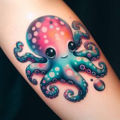 an octopus tattoo on the arm with dots and swirls around it's eyes