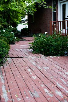 a red brick walkway leading to a house