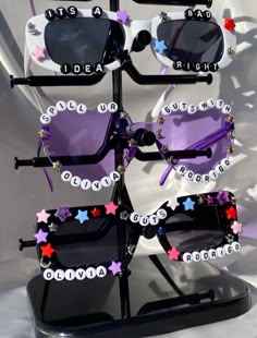 the sunglasses are decorated with stars and letters