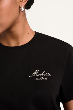 The Merlette Logo Tee is a brand new offering, introduced as a versatile complement to our skirts and pants as well as for layering under our knits. Exclusive to Merlette, it features our logo, hand embroidered with a chain stitch in contrast thread. The tee is crafted in 100% organic cotton jersey, and has a round neck and standard fit. Also available in White. Logo Hand, Logo Tee, Jersey Top, Chain Stitch, Logo Tees, Logo T Shirt, Natural Fabrics, Tshirt Logo, Timeless Pieces