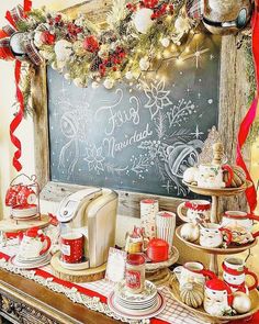 an old fashioned christmas tea party is set up on a table with red and white decorations