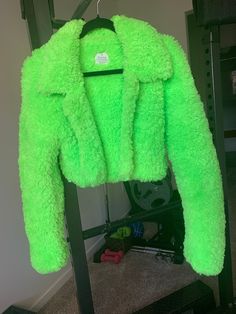 Hey girlie, I made this neon green coat for you to fulfil all your y2k, harajuku, punk, and grunge vibes. This versatile jacket can be styled to create the most fire outfits since it's unique, stylish, and bold.  Believe it or not, this is indeed crocheted (and by yours truly, no less). The colour is captured most accurately in the first two photos. It is a rich neon green. MEASURMENTS This jacket fits a US size small. * Length: 15.5 inches * Width: 20 inches * Sleeve: 28 inches DETAILS * Super warm * Cropped fit * Long arms great for tucking your hands into to keep them warm, or they can also be folded shorter without much extra bulk    since the fur blends into itself * The bottom of each side of the collar is sewn down to the bottom hem of the jacket in order to help keep the shape * Cr Fall Rave Outerwear With Long Sleeves, Fall Rave Long Sleeve Outerwear, Rave Long Sleeve Outerwear For Fall, Y2k Fitted Long Sleeve Outerwear, Trendy Green Outerwear, Trendy Green Long Sleeve Outerwear, Y2k Long Sleeve Winter Outerwear, Green Trendy Outerwear For Streetwear, Trendy Green Streetwear Outerwear