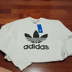 New With Tag, Size S White Adidas Logo Sweatshirt For Sports, Adidas White Sweatshirt With Letter Print, White Adidas Sweatshirt With Letter Print, White Adidas Logo Top For Streetwear, White Adidas Logo Casual Tops, Adidas White Sweatshirt With Graphic Print, Adidas Logo White Tops For Streetwear, White Casual Adidas Logo Tops, White Adidas Streetwear Tops