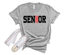 Perfect shirt for your graduating senior for their final year of High School or College or any other school or vocation. Nurses, Firefighters, etc. We can customize the hat to match your area of study! This shirt can be customized to have your school colors or have your favorite colors. Current production time is 3-5 business day. This is subject to change based on current order volume. If you need your order by a specific date please let us know before placing your order to make sure we can acc School Spirit Tops For College Graduation, Casual Tops For College Graduation, Casual Letter Print Shirt For Graduation, Casual Letter Print T-shirt For Graduation, Casual Shirt With Text Print For Graduation, Casual T-shirt For Graduation, School Spirit Shirt With Letter Print For College Events, Casual Graduation Shirt With Text Print, Casual T-shirt With Letter Print For Graduation