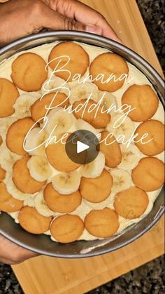 someone holding a cake with bananas on it and the words banana pudding in the middle