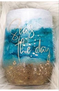 a painted glass with the words seas of the day on it