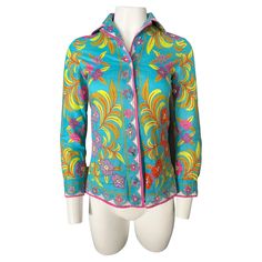 - Featuring blue, pink, purple, yellow, orange colors - 100% cotton - Floral motif pattern - Long sleeves - Collar - Front button closure - Fits XS/S Purple Yellow Orange, Motif Pattern, Blue Pink Purple, Designer Blouses, Emilio Pucci, Blouse Vintage, Yellow Orange, Floral Motif, Fashion Boutique